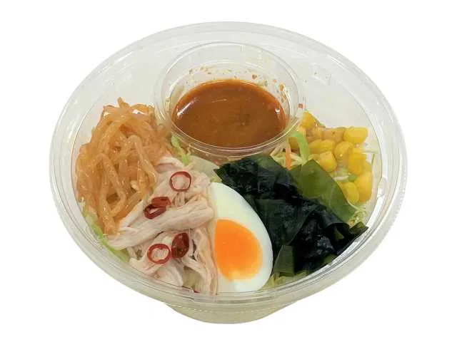 Spicy ramen salad with steamed chicken and soft-boiled egg
