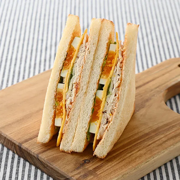 Toast Sandwich with Domestic Chicken Breast and Boiled Egg, Fresh Basil Sauce and Cheddar Cheese — Available in select areas of Tokyo and Kanagawa