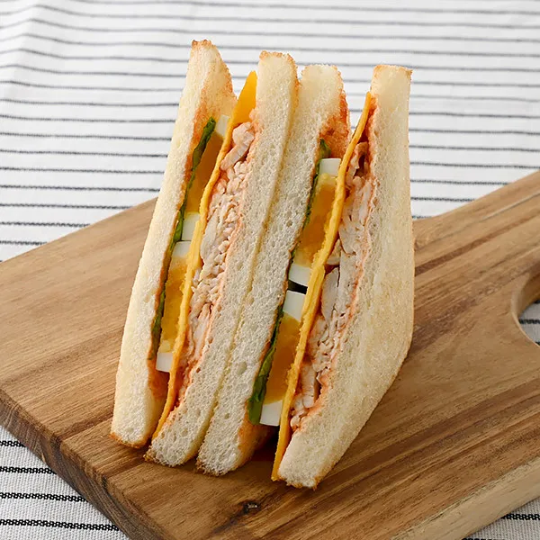 Limited to select areas in Tokyo and Kanagawa: Toast Sandwich with Domestic Chicken Breast and Boiled Egg, Cream Cheese Sauce and Cheddar Cheese